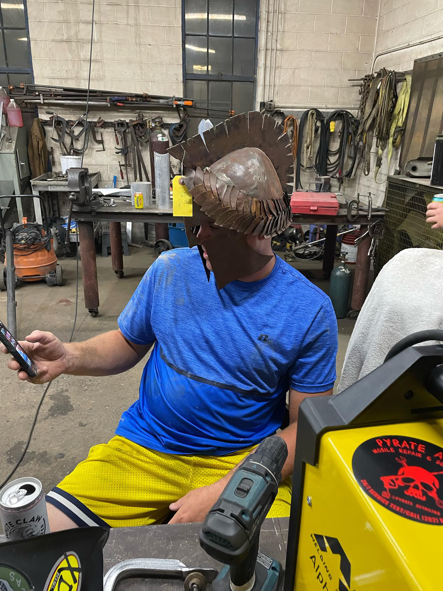 Metal artist wearing the handmade steel helmet