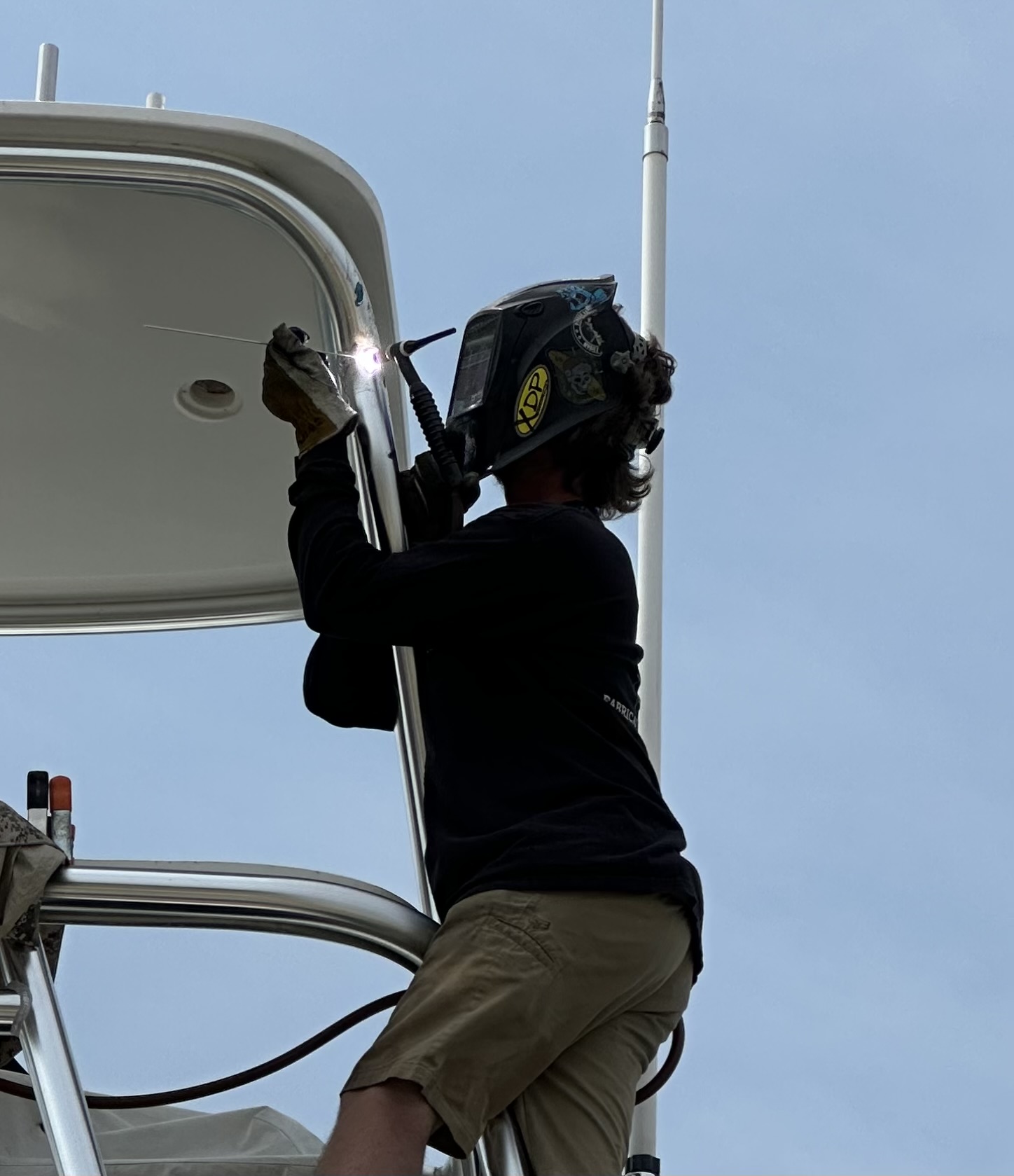 Close view of welding an aluminum boat T-top