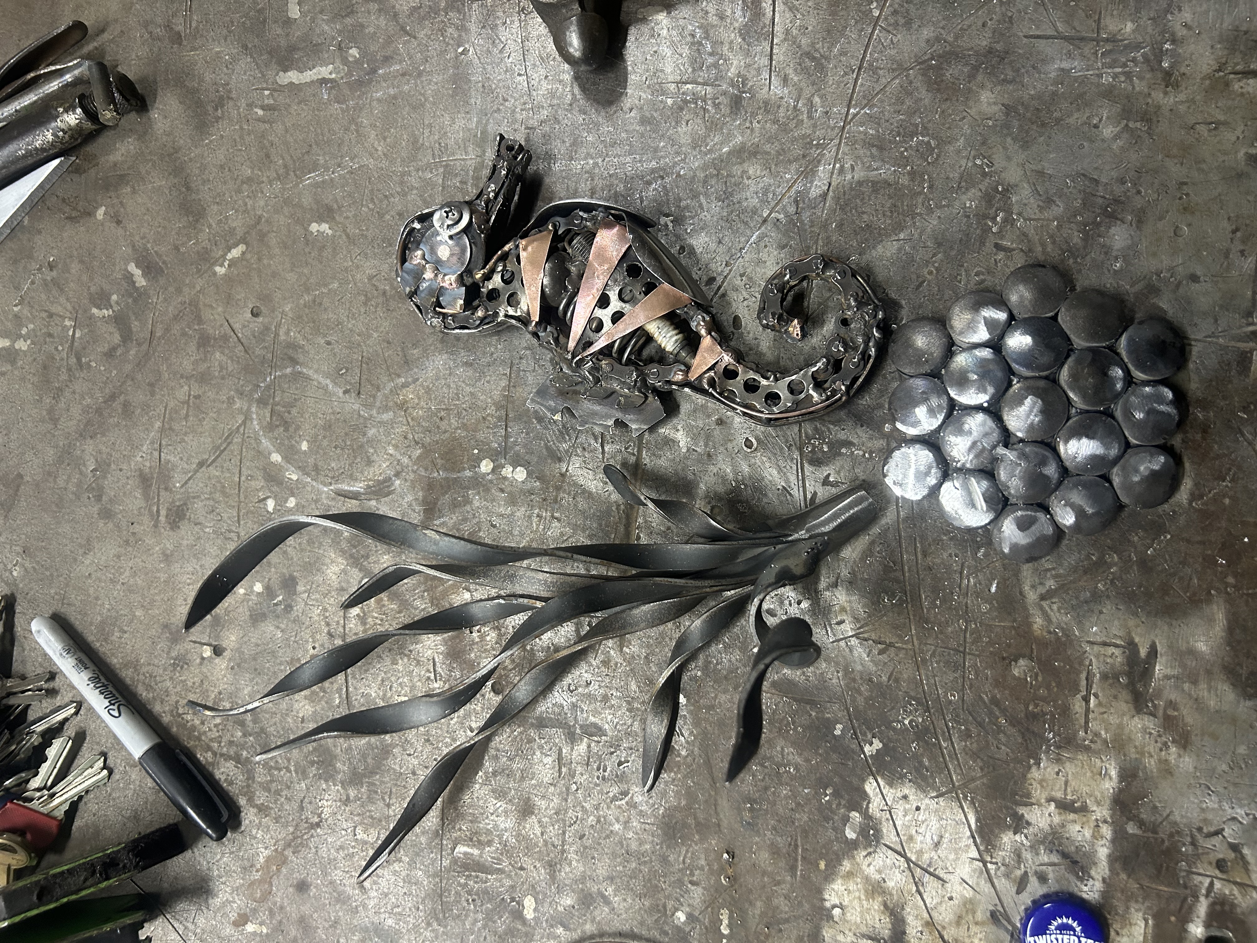 Steel seahorse and hand-shaped kelp detail