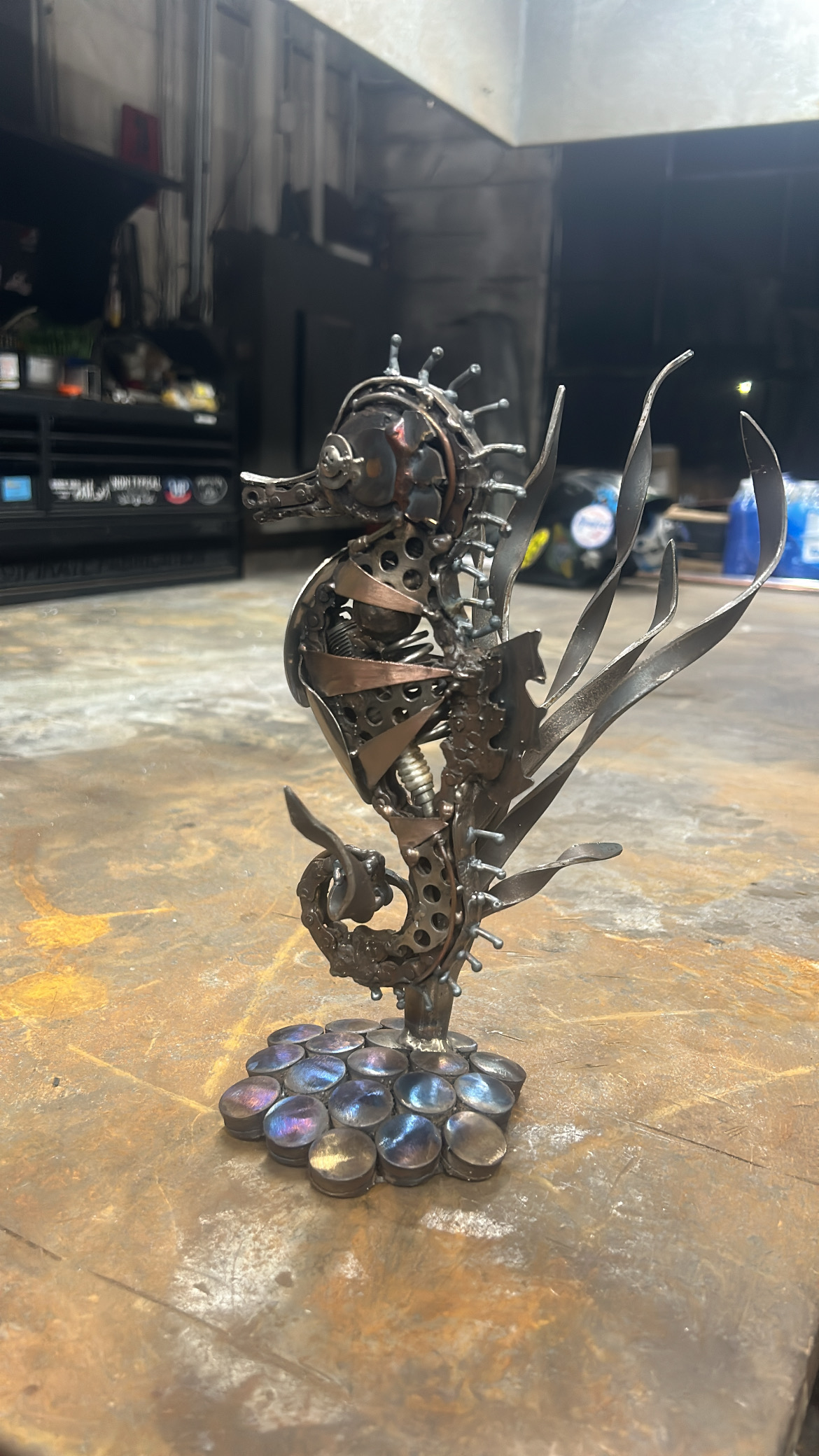 Layered steel seahorse sculpture on display