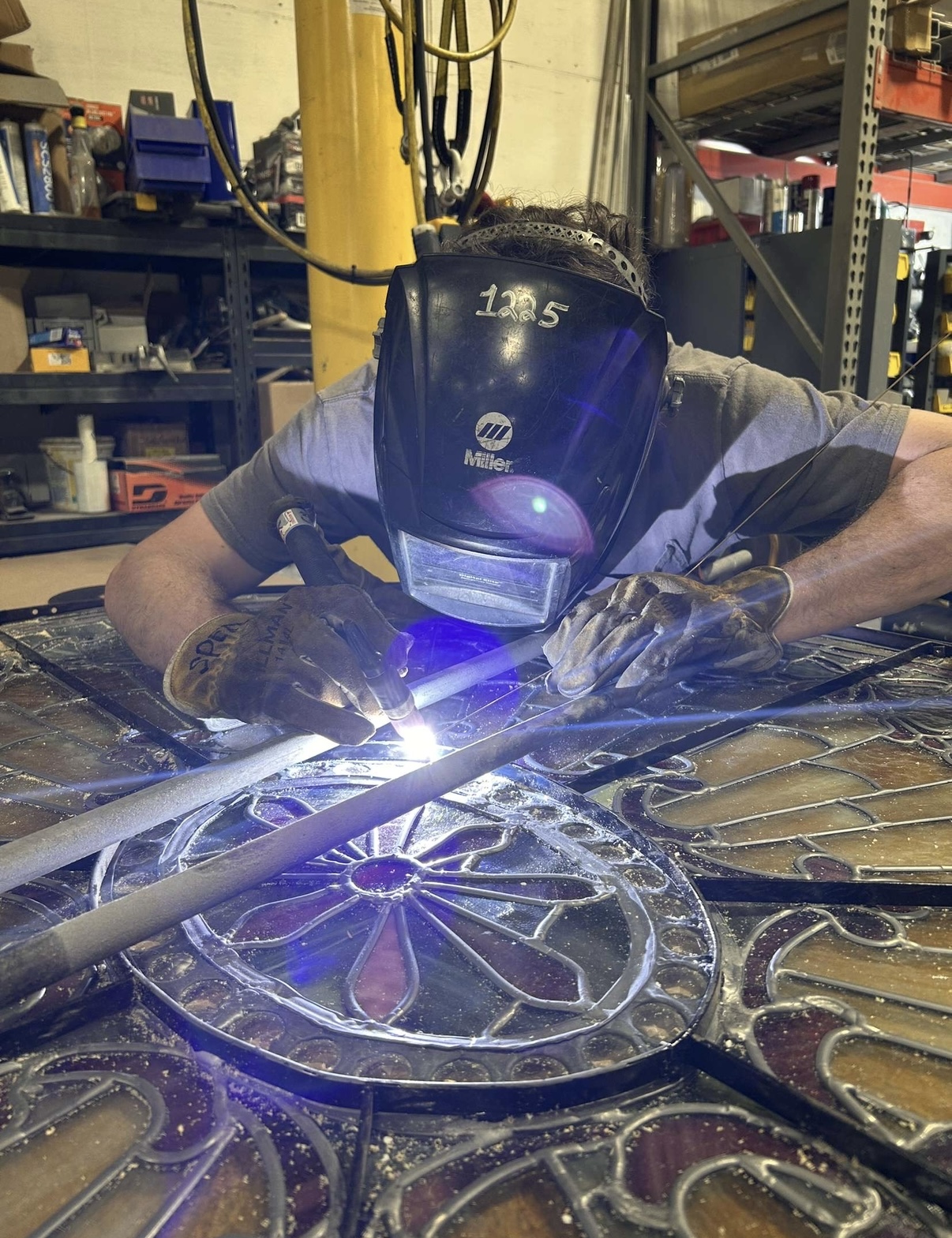 Decorative metal gate panel being welded